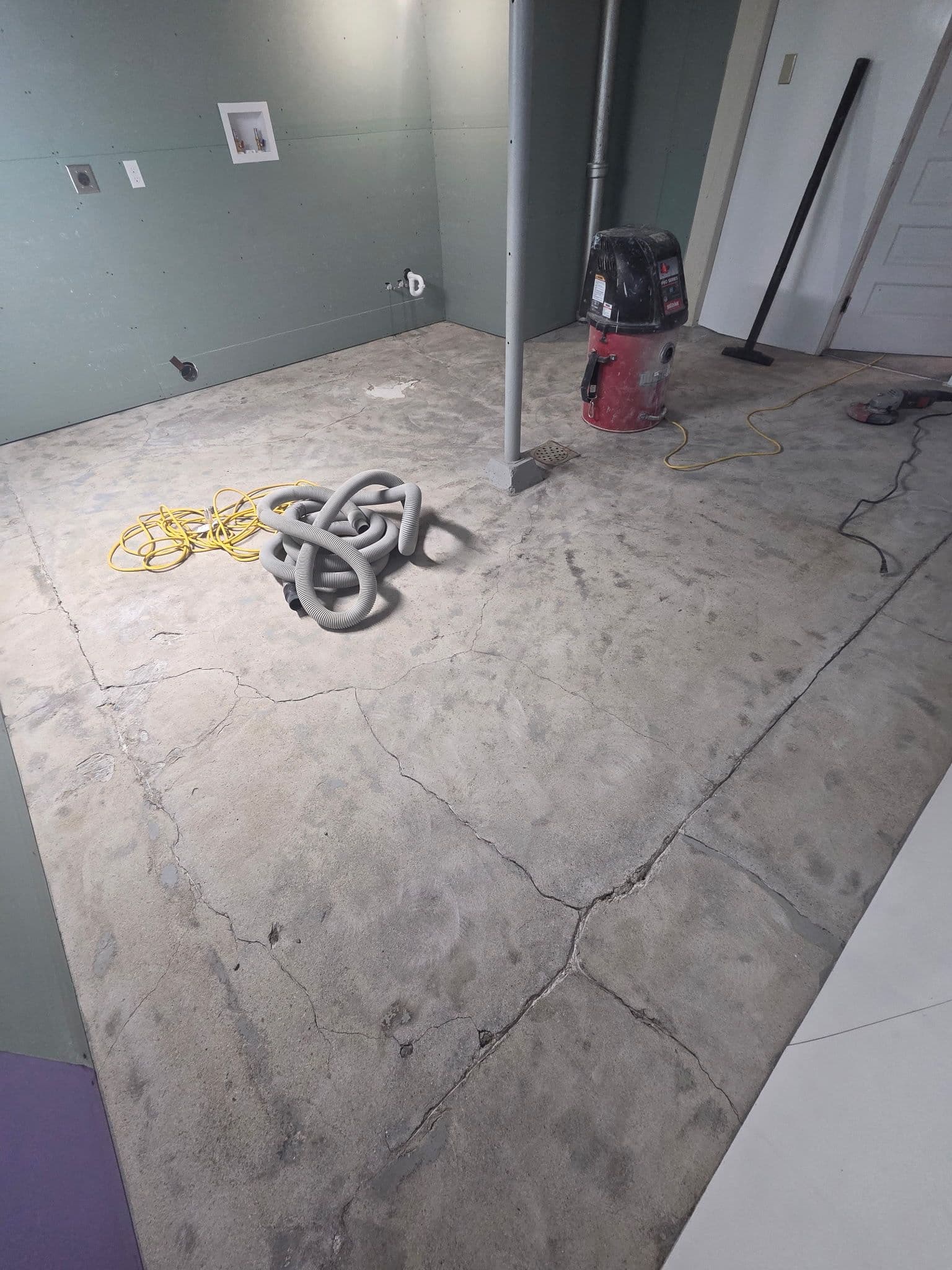 Cracked Laundry Room Floor Gets a Full Flake Epoxy Finish in Lakeville