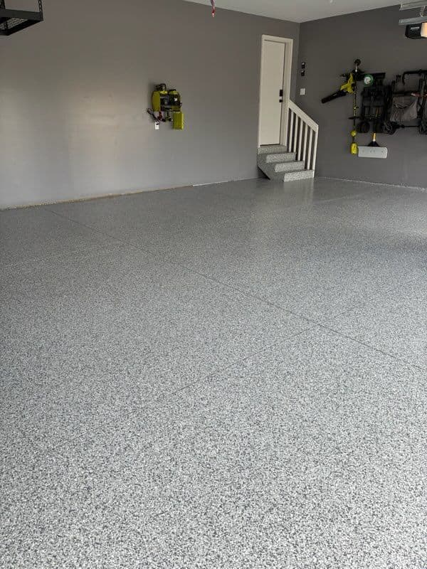 Garage Transformation with Flaked Epoxy Flooring image